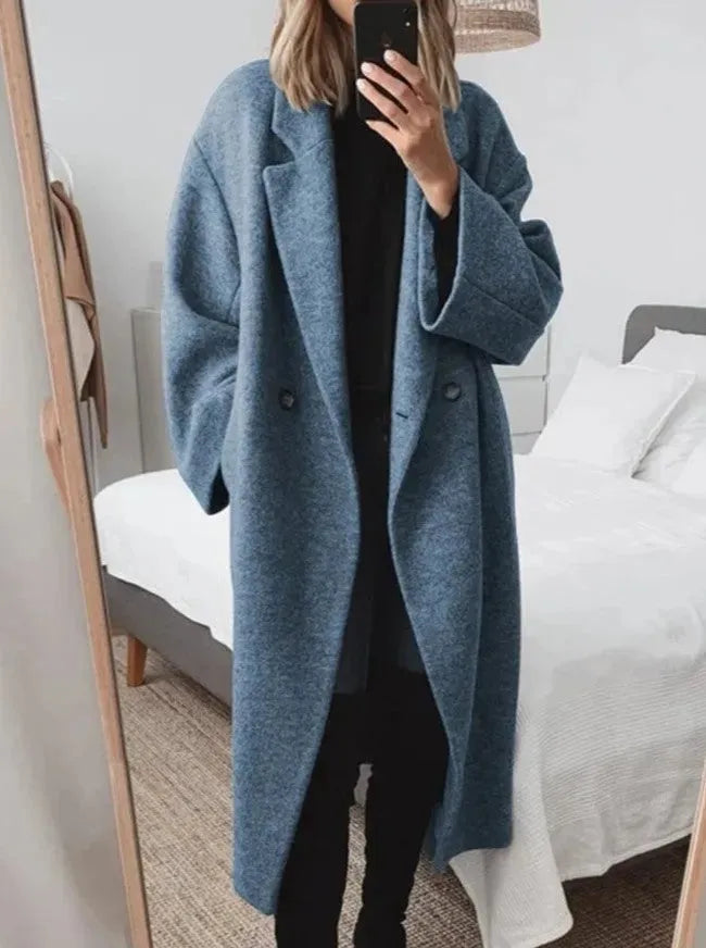 Stylish double-breasted long coat for women, an elegant oversized outerwear piece for casual wear.