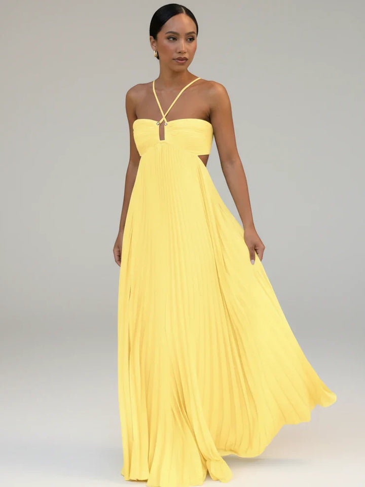 Blue women's pleated A-line maxi dress. Flowy casual or formal summer dress with elegant cutout details.