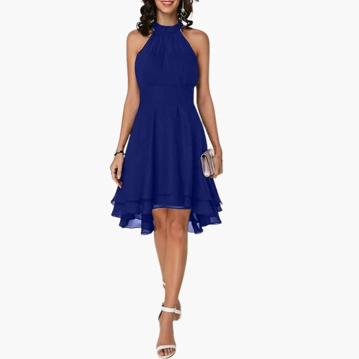 Chic women's ruffle sleeveless dress with a round neck. Comfortable knee-length summer dress, ideal for casual outings.