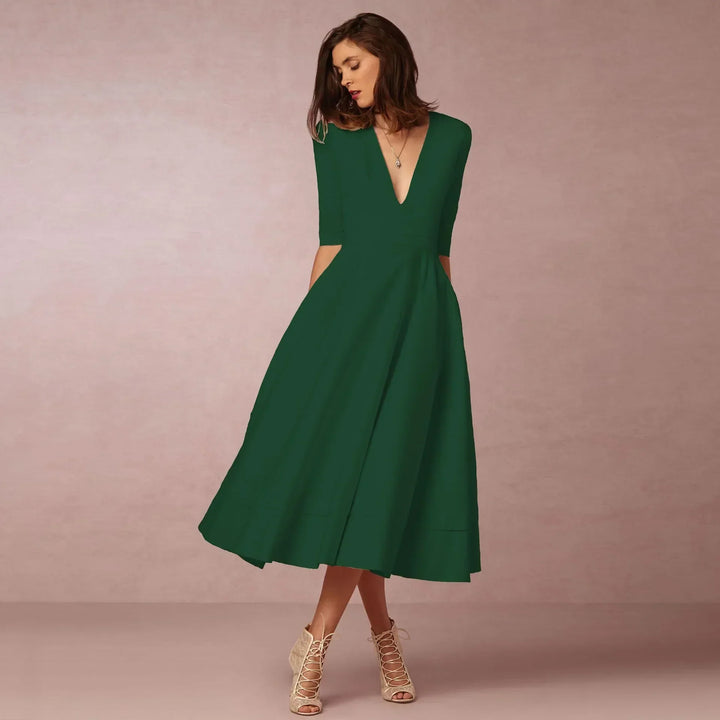 Elegant V-neck midi dress for women, featuring comfortable elbow sleeves and a classic silhouette.