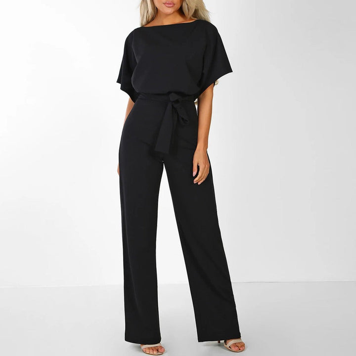 Sophisticated wide-leg jumpsuit for women with an elegant belted waist. Ideal versatile occasion wear.