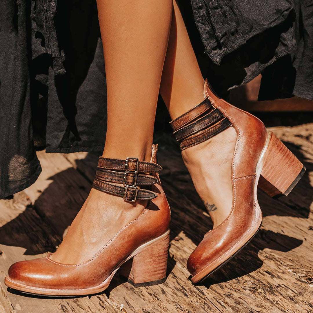 "Elegant women's block heel ankle boots in black, with round toe and back zipper, perfect for chic and comfortable wear."