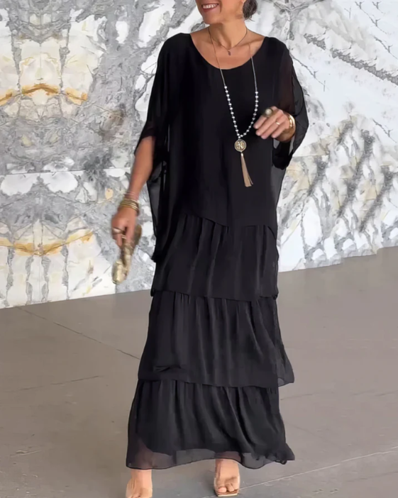 Comfortable women's long sleeve tiered maxi dress, featuring a relaxed fit and stylish flowy design.