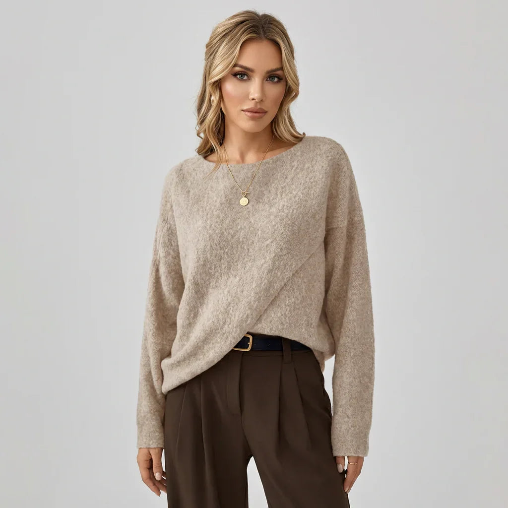 Women's oversized batwing sweater with crew neck, loose fit & asymmetrical hem. Casual & comfortable for autumn.