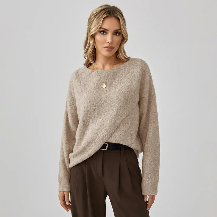 Women's oversized batwing sweater with crew neck, loose fit & asymmetrical hem. Casual & comfortable for autumn.