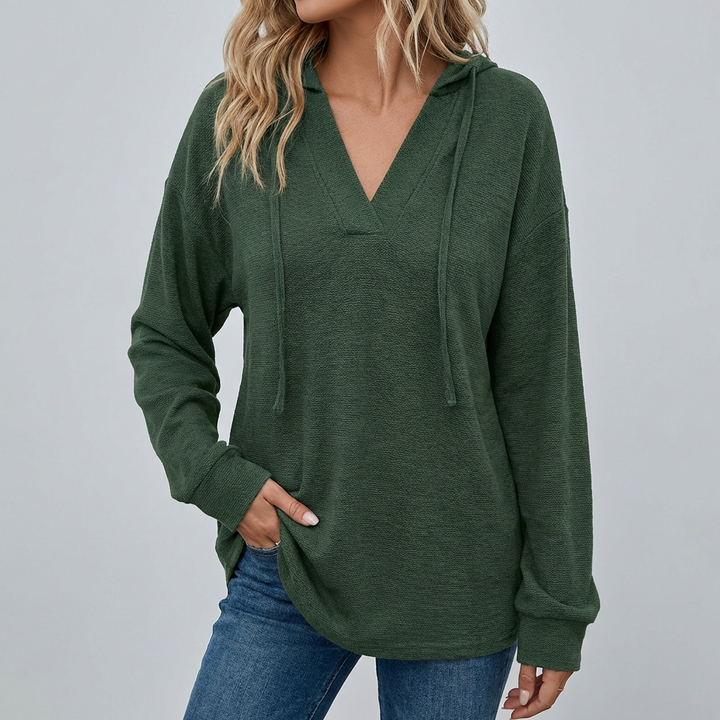 Effortless women's oversized V-neck hoodie, offering a comfortable, relaxed fit for a chic casual look.