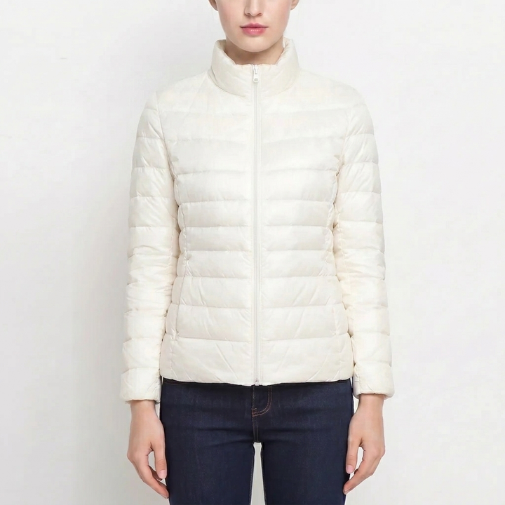 Women's cozy quilted puffer jacket. Slim fit, warm winter coat, ideal for autumn casual fashion.