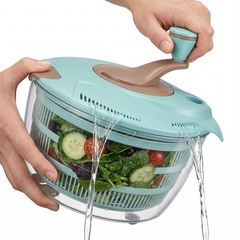 Close-up of a kitchen vegetable spinner, showing dual drainage for efficient washing & drying of greens & produce.