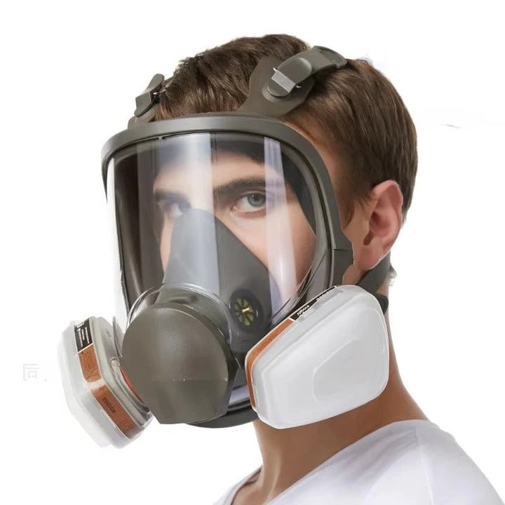 Worker wearing unisex full face respirator mask, providing anti-fog eye & respiratory protection for safety.
