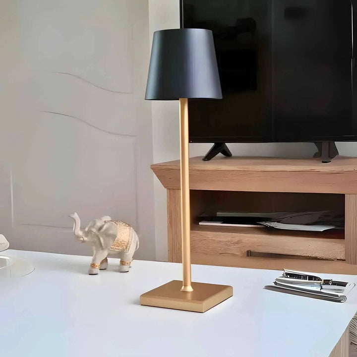 Stylish cordless LED desk lamp. Dimmable touch control for bedside or office ambient lighting. Modern & portable.