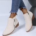 Pair of black women's zip-up ankle boots from above, showcasing their sleek design