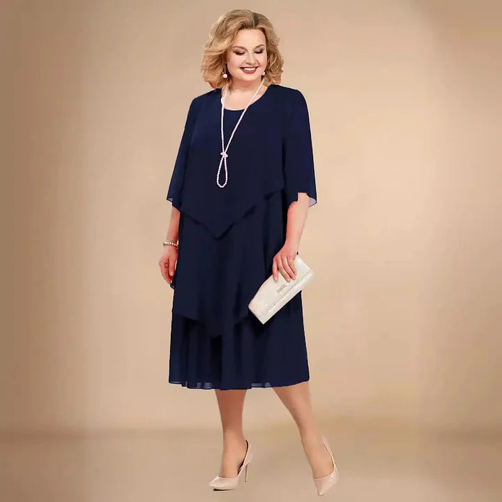 Elegant navy blue A-Line midi dress for women. Versatile round neck & 3/4 sleeves make it perfect for any occasion.