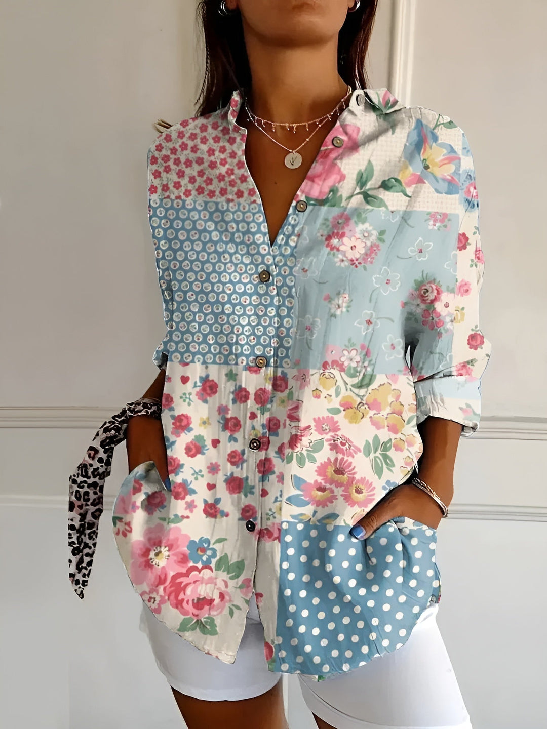"Lightweight women's button-down summer blouse with classic collar, full-length sleeves, in breathable fabric for sunny days.