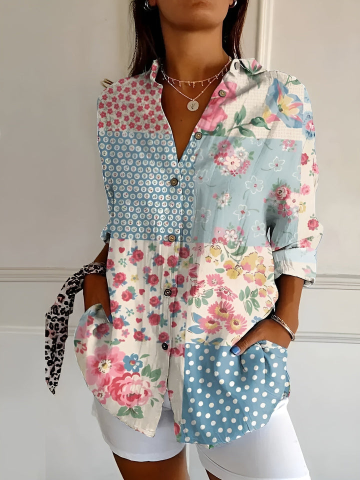 "Lightweight women's button-down summer blouse with classic collar, full-length sleeves, in breathable fabric for sunny days.