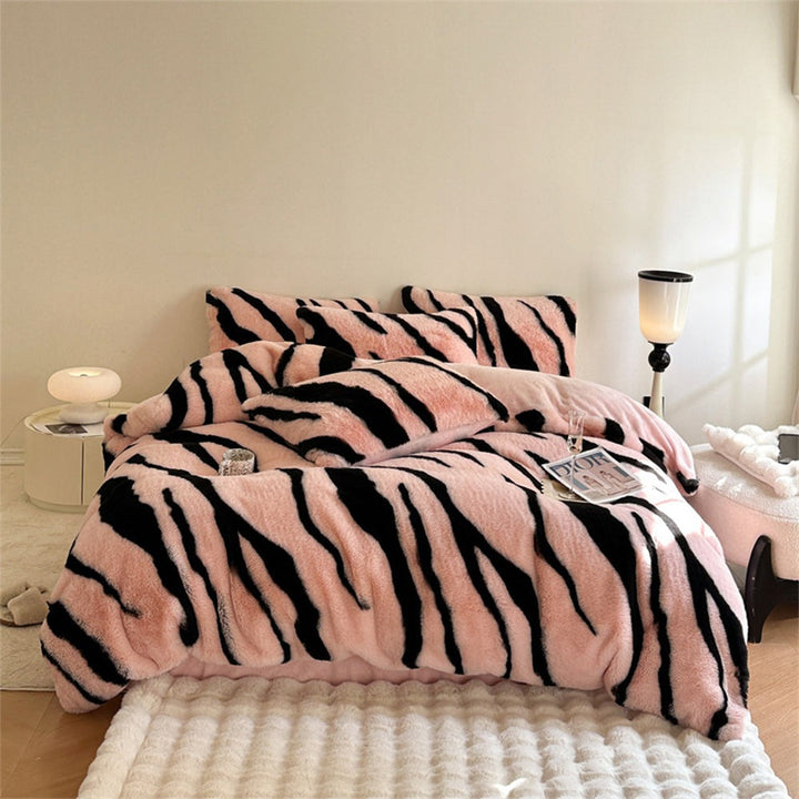 Vibrant zebra print fluffy faux fur bed sheets. Luxurious animal print bedding adds cozy warmth to any bedroom decor.