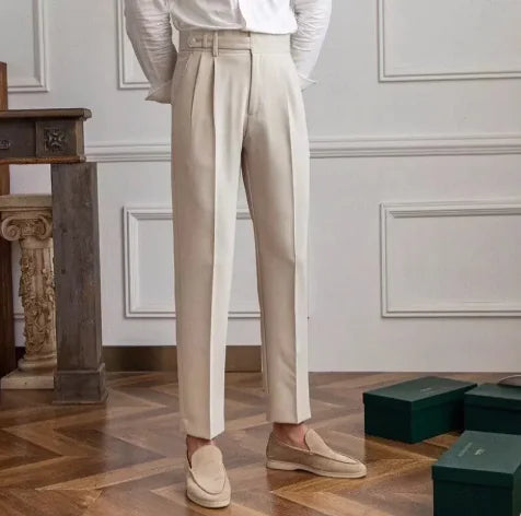 Full-length view of men's slim-fit cropped suit trousers in charcoal, versatile for business or smart casual.