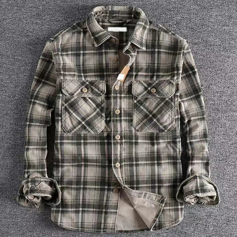 Close-up of a men's plaid flannel shirt, showcasing the soft fabric and classic button-up design.