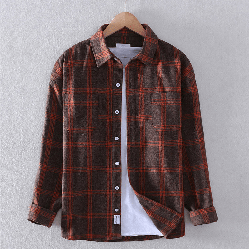 Close-up of a man's casual checkered long-sleeve shirt, highlighting the fabric and button details. Men's plaid.