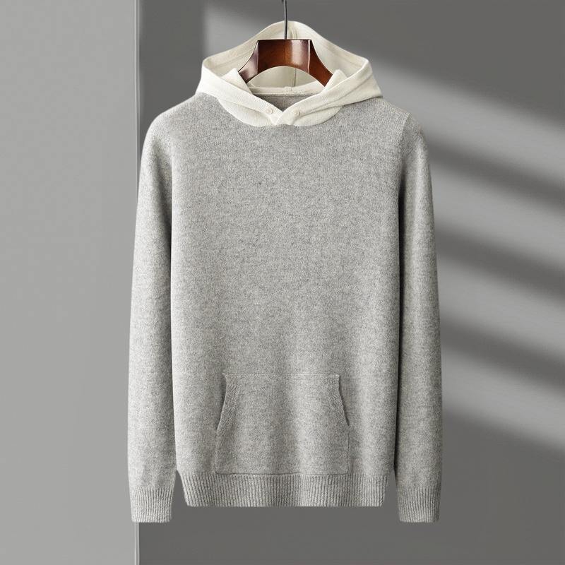 Flat lay of the merino wool pullover hoodie, showcasing its full design and the softness of the fabric.