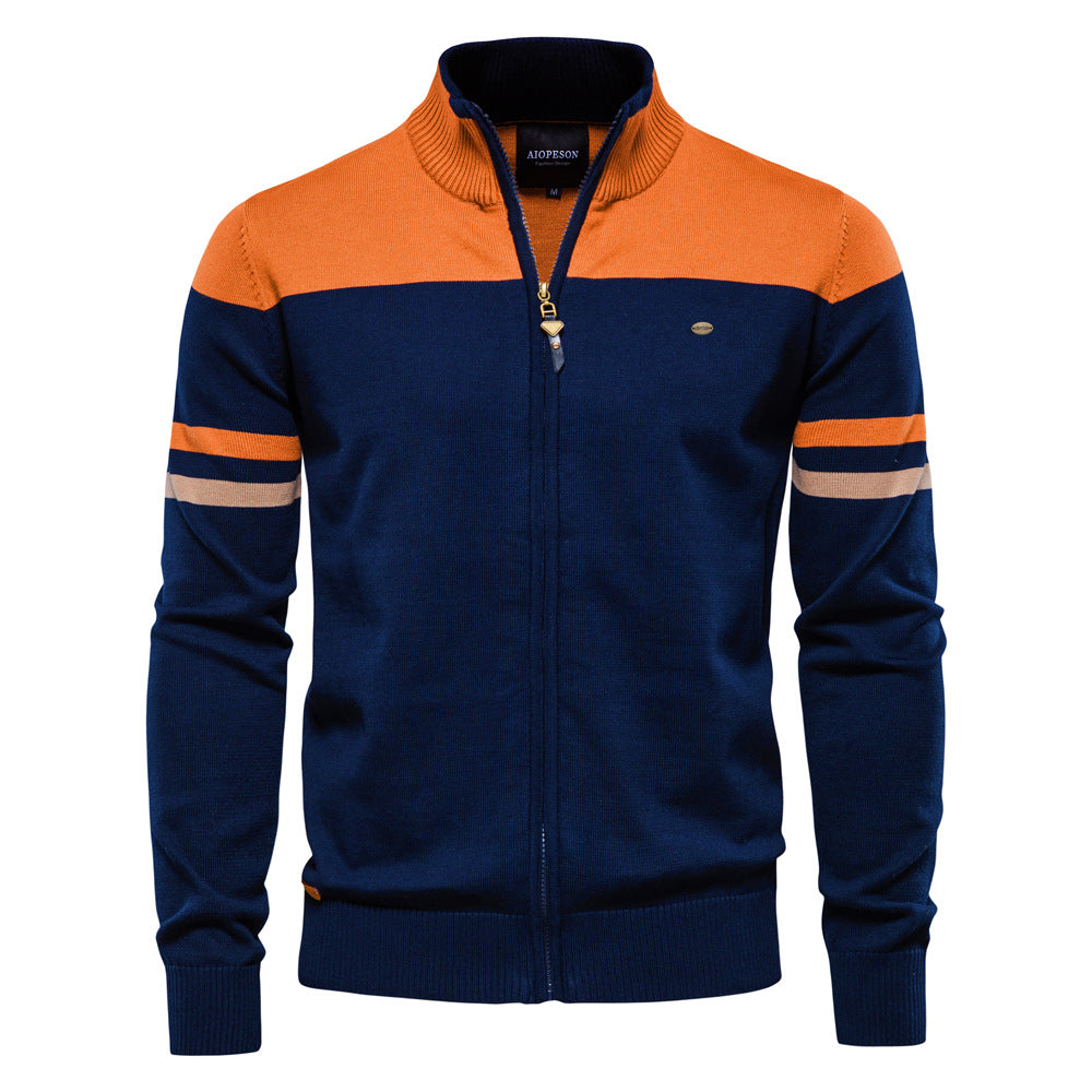 Close-up of the knit texture on a men's colorblock zip-up cardigan sweater, casual outerwear.