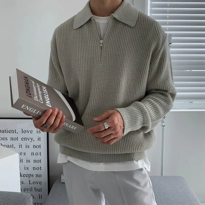 Sophisticated men's fall fashion sweater, quarter zip and jacquard knit, offering warmth and style.