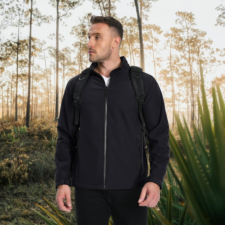 Side profile of a man wearing a brown lightweight bomber jacket, suitable for fall fashion.