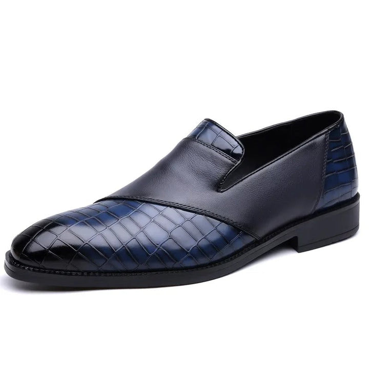 A pair of luxurious men's croc-textured loafers, designed for the modern man