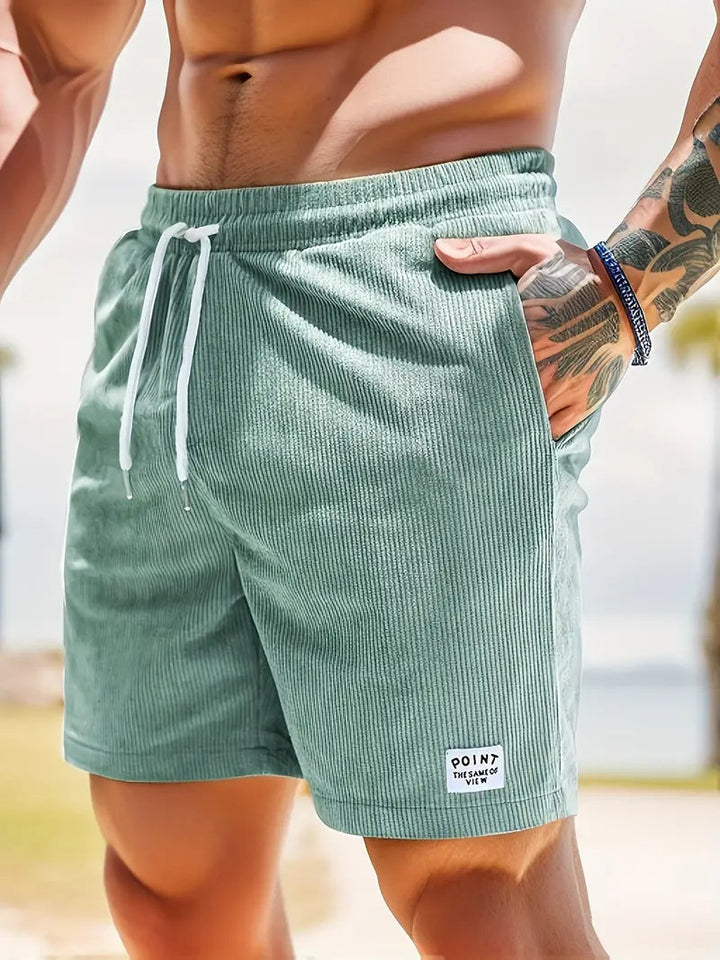 Designer men's quick-dry swim shorts, a must-have for modern beach fashion.