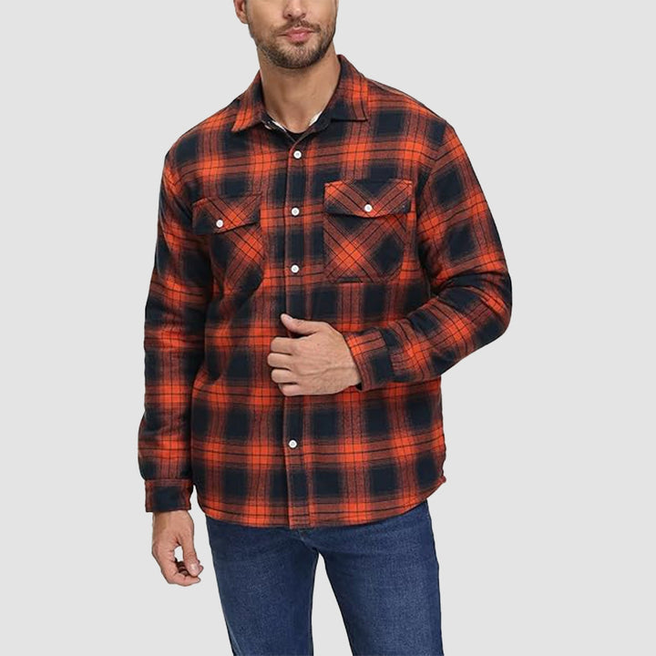 Close-up of the soft fleece lining inside a men's flannel button-down jacket, ideal for cold weather outerwear