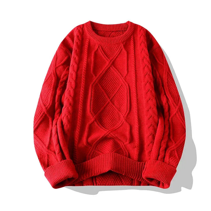 Close-up of a men's cable knit sweater showing intricate knit pattern and relaxed fit design.