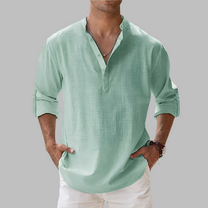 Relaxed fit men's button-down shirt, long sleeve for breathable summer casual wear & vacation style.