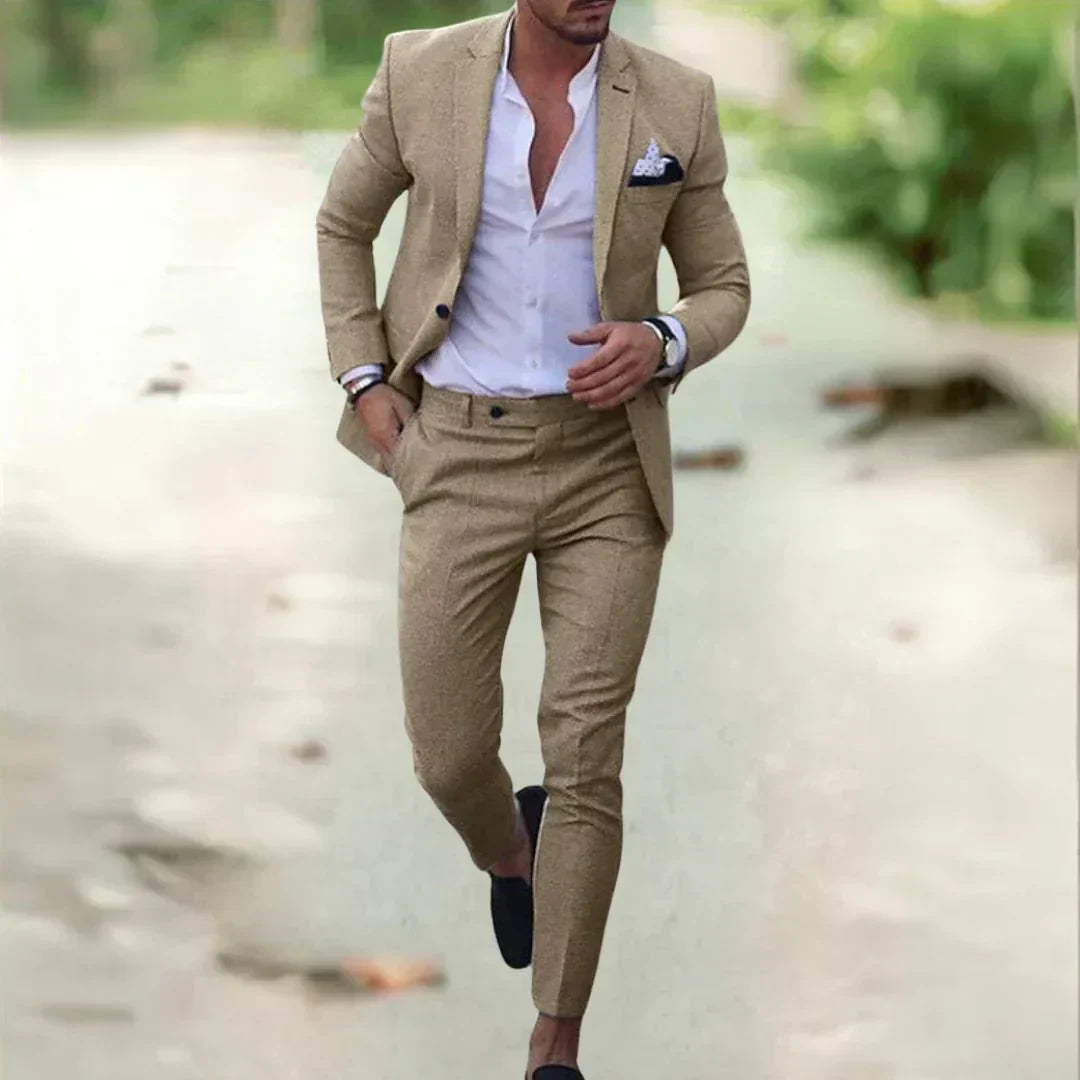 Professional men's slim fit two-piece business suit for sharp modern style in the office or formal corporate events.