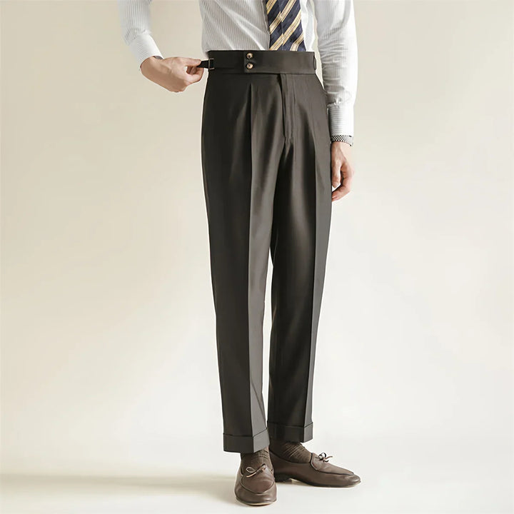 Close-up of the fabric on men's tailored dark blue business trousers, showing cotton blend texture.