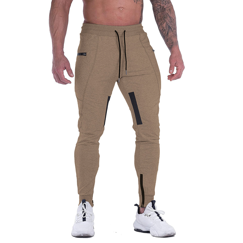 Man running in gray tapered athletic joggers, demonstrating flexibility and activewear suitability
