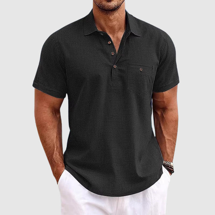 "Men's textured polo shirt with chest pocket, short sleeves, turn-down collar, and relaxed fit for warm-weather comfort."
