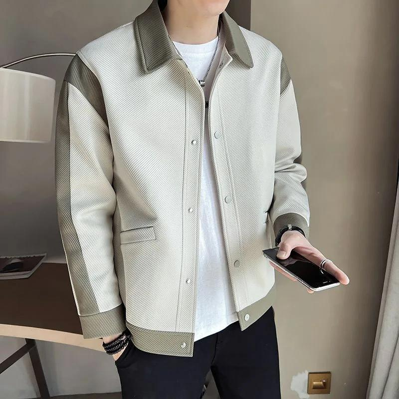Stylish men's patchwork jacket featuring a lapel collar & snap button closure. Unique long-sleeve casual outerwear.