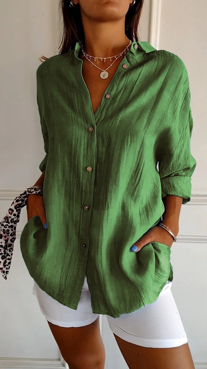 Modern women's relaxed fit blouse, versatile and stylish button-down apparel.