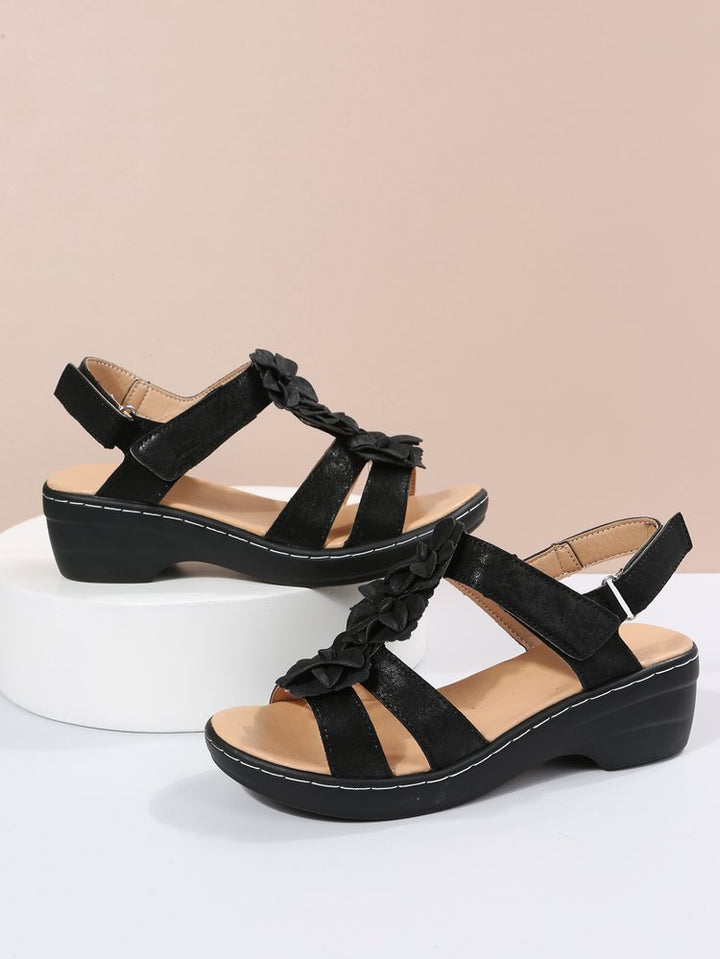 Retro chic women's sandals with a comfortable wedge heel. Perfect orthopedic footwear for summer.