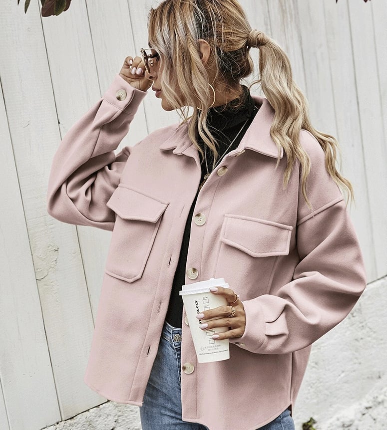 Elegant women's short beige jacket with button placket. Perfect versatile autumn outerwear for casual or office wear.