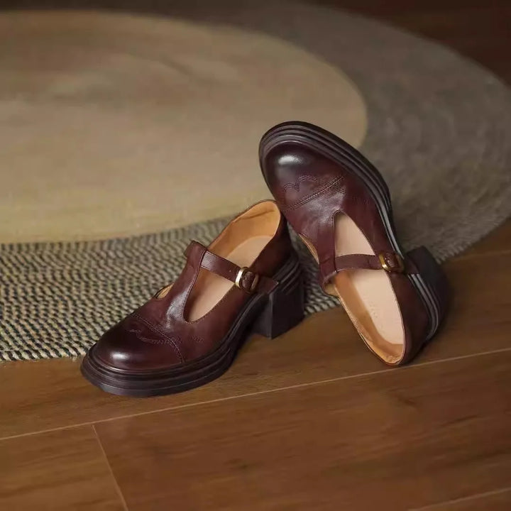 Classic women's leather T-strap block heel shoes, offering comfortable and stable footwear for any occasion.