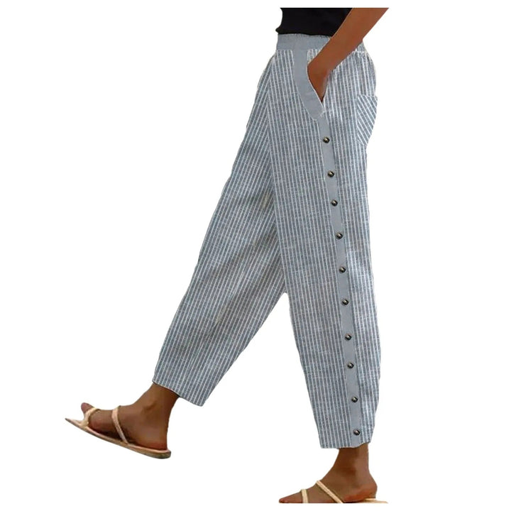 Chic high-waist striped women's trousers with elegant decorative buttons, ideal for office or casual wear.