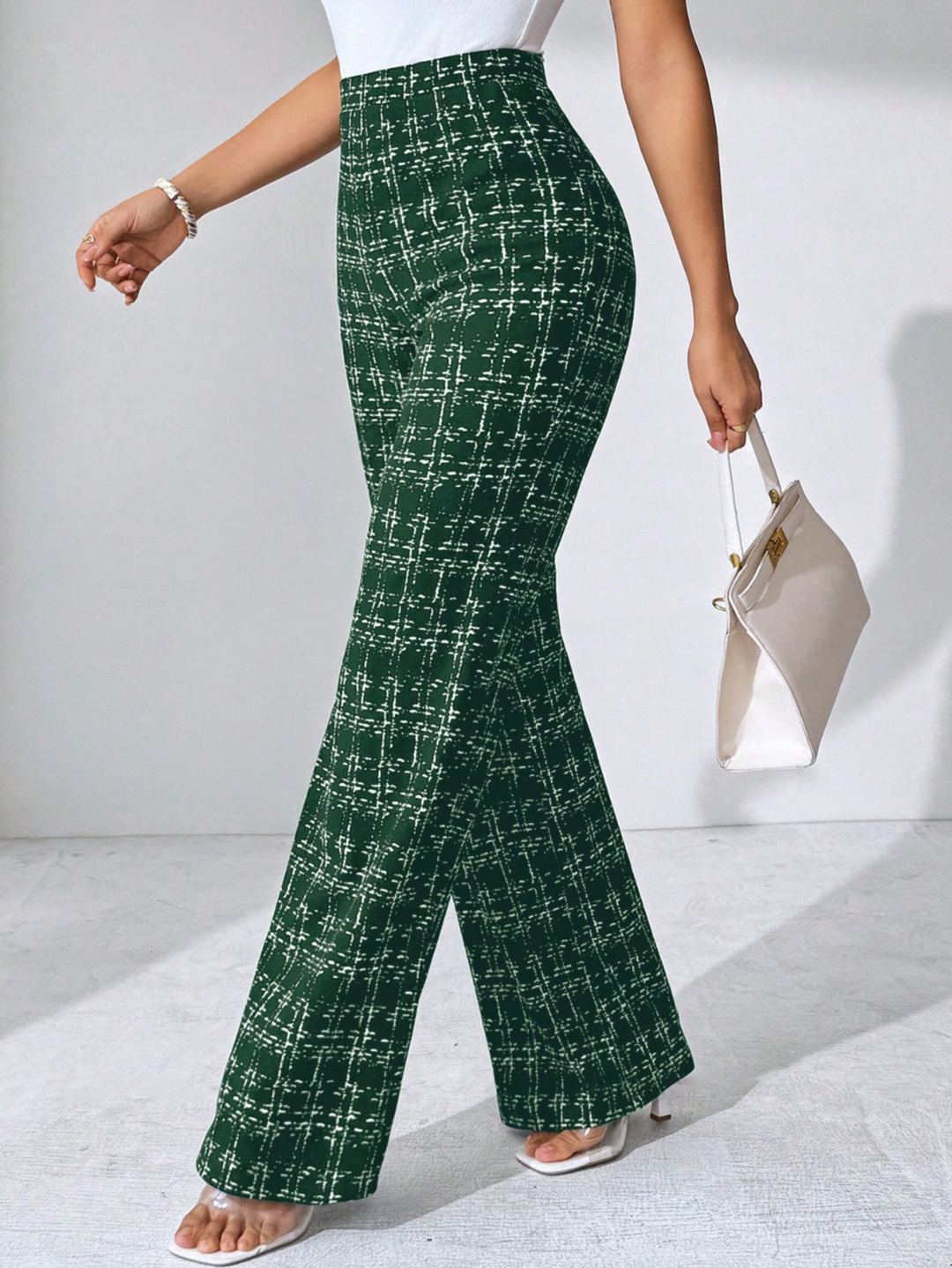 Fashionable women's plaid knit trousers with a flattering high waist and flared bottom.