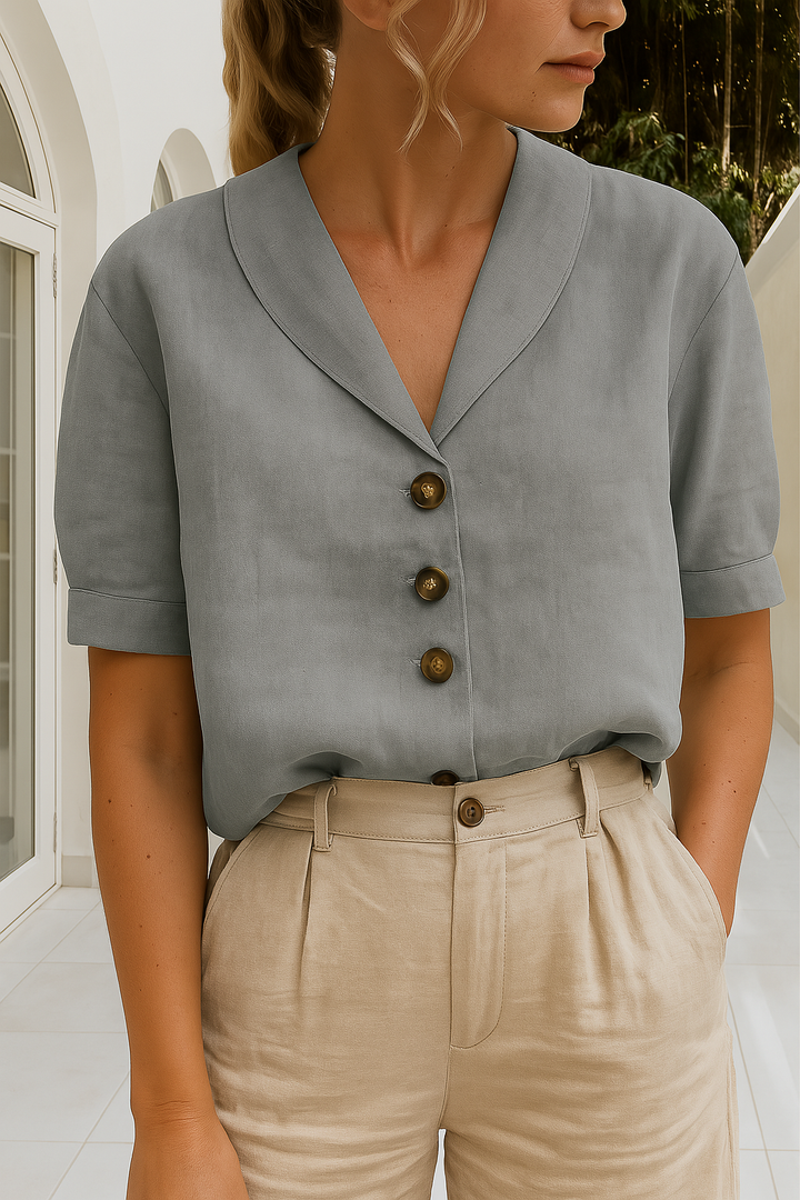 Comfortable short sleeve women's V-neck button-up blouse, great for versatile casual or professional outfits.