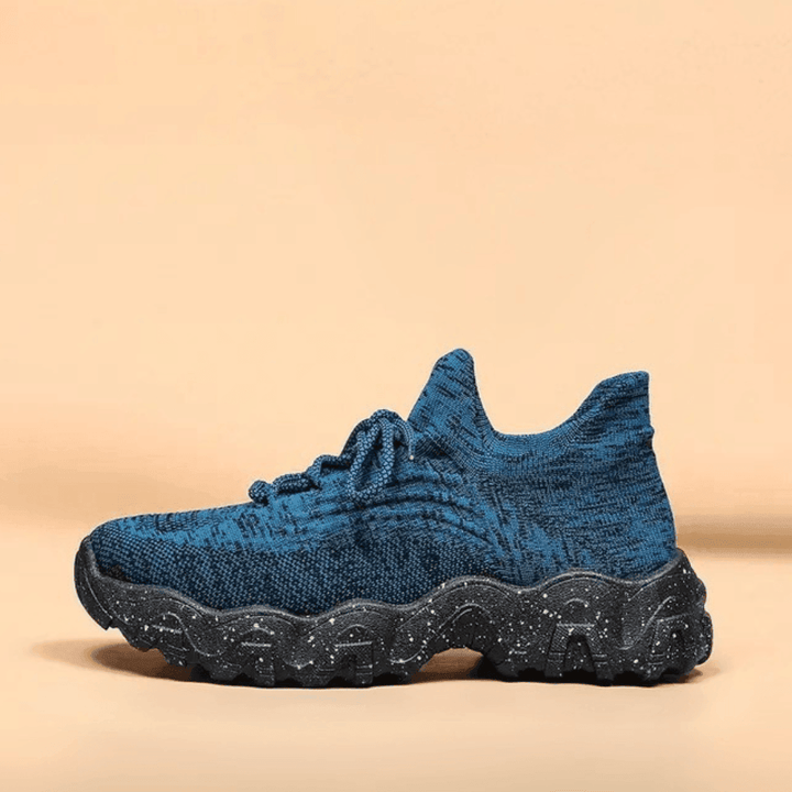 Side profile of a Unisex Everyday Comfort Low-Top Sneaker, showcasing its low-top design and comfort