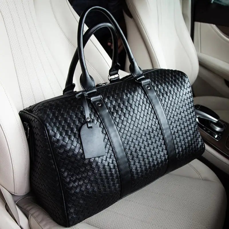 Unisex woven vegan leather travel duffle bag, perfect for weekend trips or gym, with durable construction.