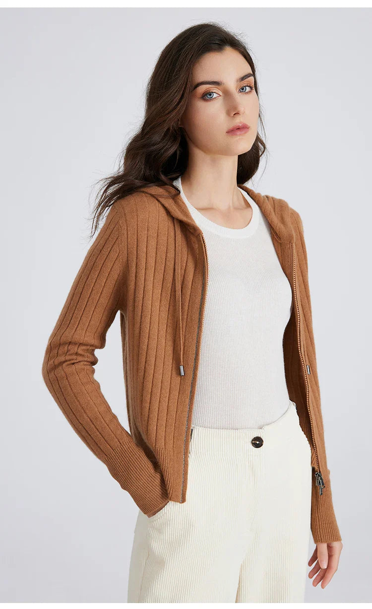 Woman wearing a cream ribbed full-zip hooded knit cardigan, perfect for casual layering.