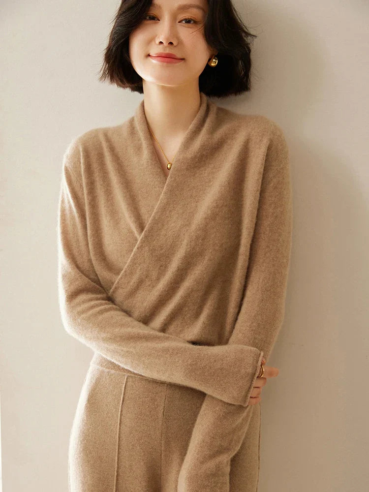 Detail of the knit and crossover on an ivory cashmere sweater