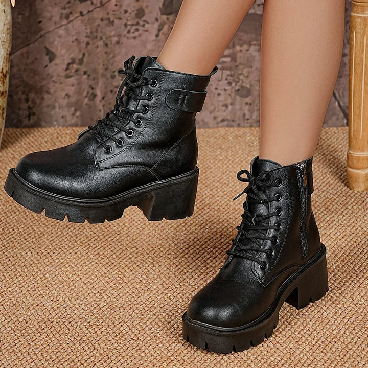 Women's black chunky sole lace-up ankle boots, stylish & comfortable. Perfect trendy footwear.