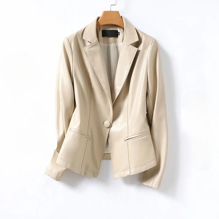 Full shot of a women's black vegan leather blazer, highlighting its sleek design and flattering fit.