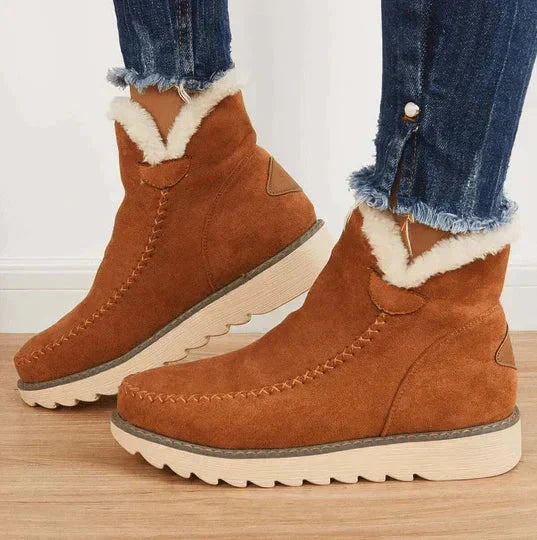 Close-up of women's slip-on fleece-lined platform ankle boots, highlighting the soft interior and sturdy sole